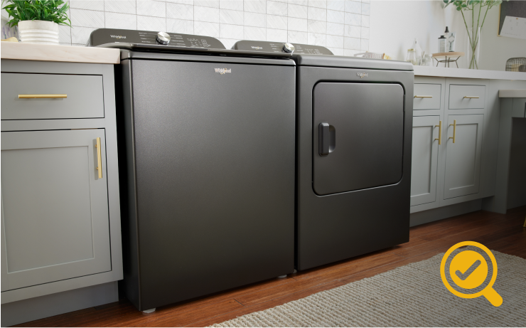 A laundry room with a Whirlpool® Top Load Washer and Dryer